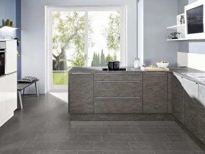 Cucina Moderna finitura effetto pietra con penisola Stone Basalto di Nolte